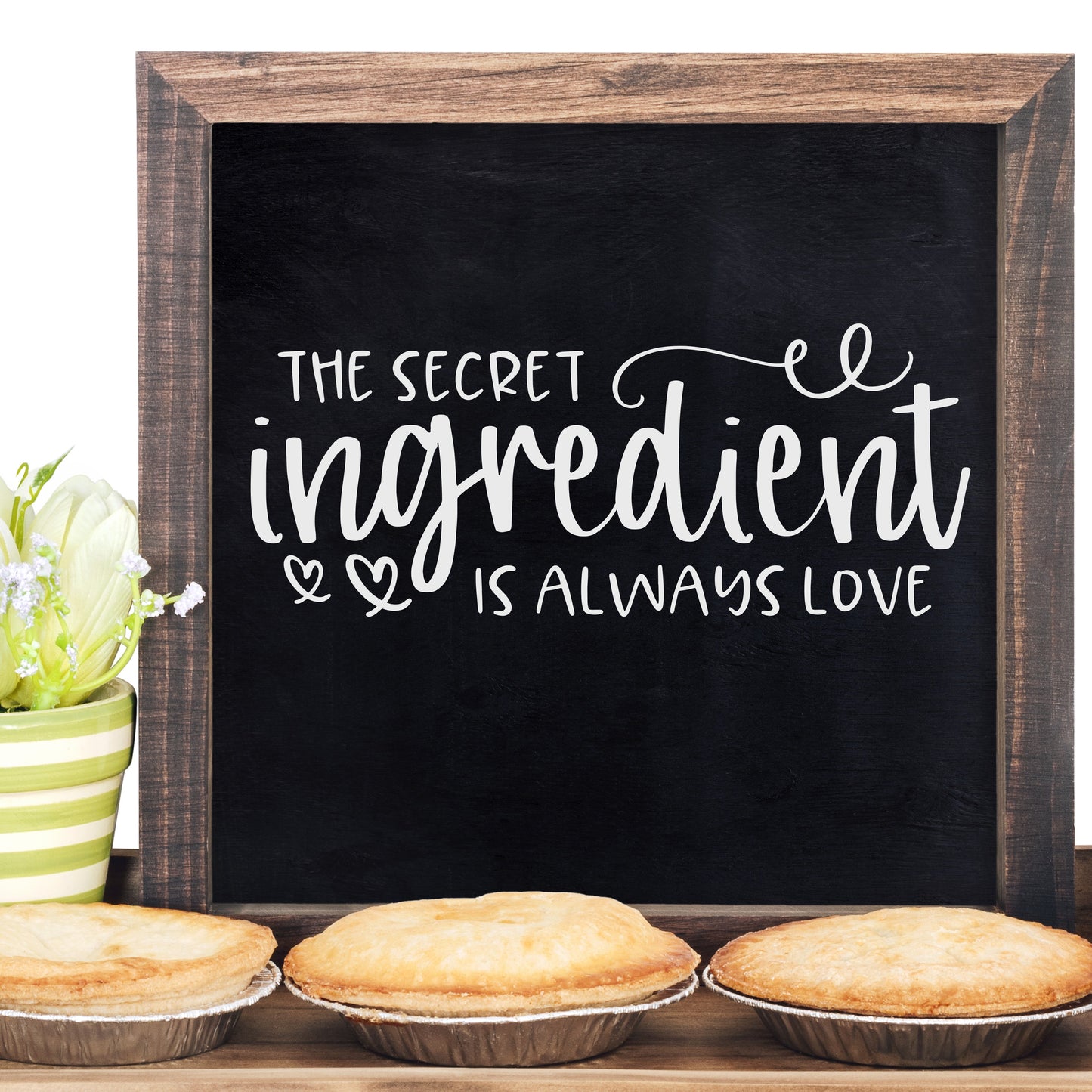 Rustic chalkboard "The secret ingredient is love" farmhouse sign.